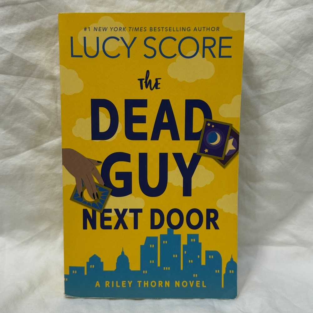 “The Dead Guy Next Door: A Riley Thorn Novel” Paperback Romance by Lucy Score